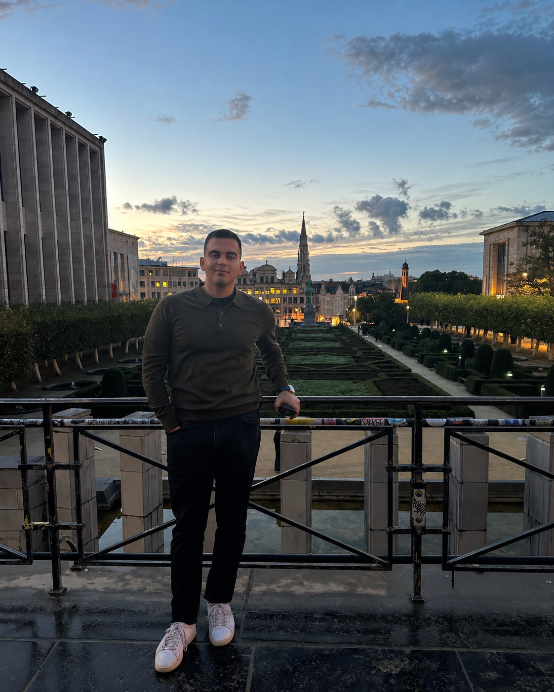 Vasilis Fioravantes standing on a bridge at sunset